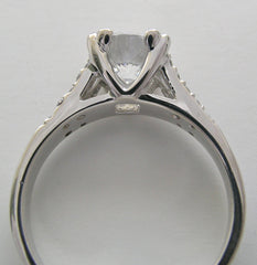 ELEGANT DIAMOND ACCENTED ENGAGEMENT RING SETTING FOR A ROUND CENTRAL STONE