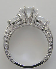 UNUSUAL ROUND AND HEART SHAPE DIAMOND ENGAGEMENT RING SETTING