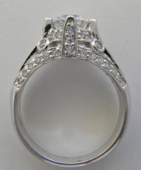 IMPORTANT ENGAGEMENT RING SETTING WITH ROUND DIAMOND ACCENTS 0.67 CT.