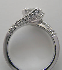 GRACEFUL UNUSUAL ENTWINNED SWIRL DESIGN SOLITAIRE RTING SETTING WITH DIAMOND ACCENTS